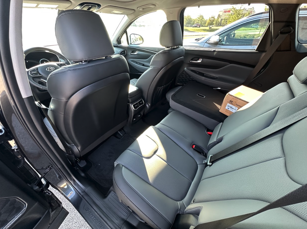 Spacious rear seating area in a Hyundai SUV with folded seat and family-ready features